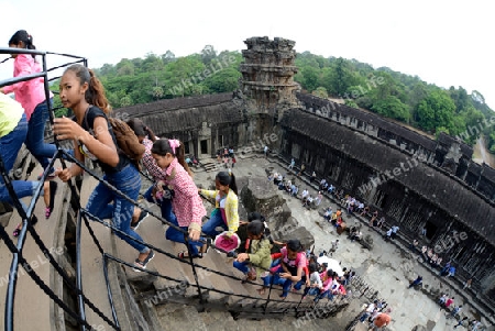 Tourists at the Angkor Wat in the Temple City of Angkor near the City of Siem Riep in the west of Cambodia.