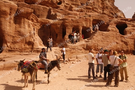 Tourists in the Bab as Siq valley in the Temple city of Petra in Jordan in the middle east.