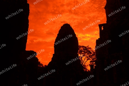 Stone Faces the Tempel Ruin of Angkor Thom in the Temple City of Angkor near the City of Siem Riep in the west of Cambodia.