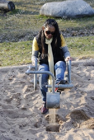 woman playing in the sand