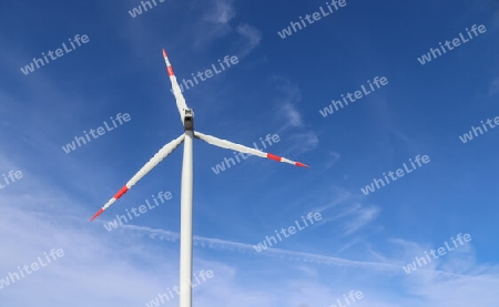 View on alternative energy wind mills against the sky