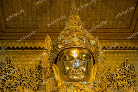 The Mahamuni Buddha at the Mahamuni temple in the City of Mandalay in Myanmar in Southeastasia.