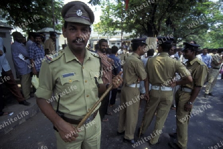 a group of police men in the city of Kochi in the province Kerala in India.