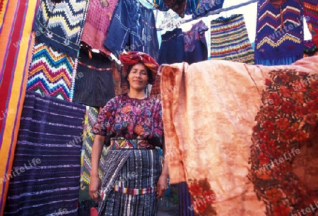 people in traditional clotes at the Market in the Village of  Chichi or Chichicastenango in Guatemala in central America.   