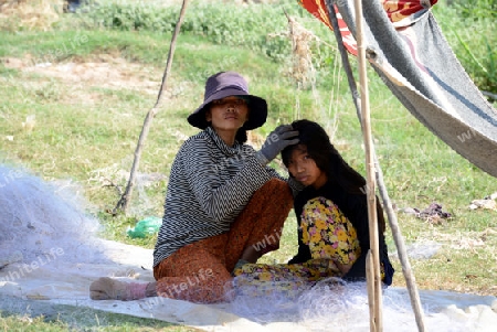 The People at wort in the Lake Village Kompong Pluk at the Lake Tonle Sap near the City of Siem Riep in the west of Cambodia.