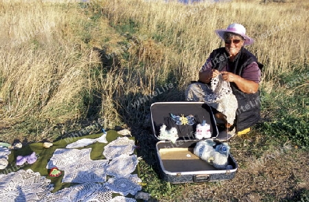 a women is making souveniers near the town of Balcik in Bulgaria in east Europe.