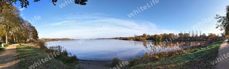 Beautiful high resolution panorama of a northern european country landscape with fields and green grass.