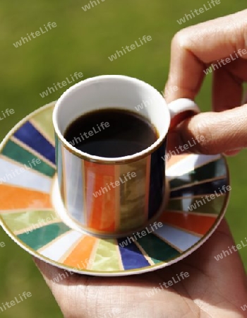 espresso cup on green background