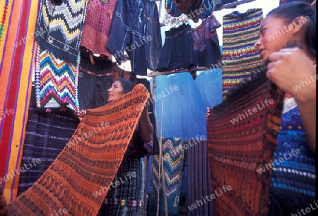 people in traditional clotes at the Market in the Village of  Chichi or Chichicastenango in Guatemala in central America.   