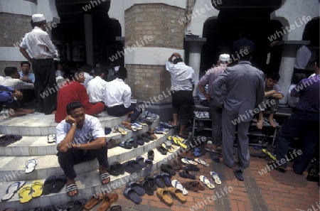 Muslim prayers at a Mosque in the city of  Kuala Lumpur in Malaysia in southeastasia.