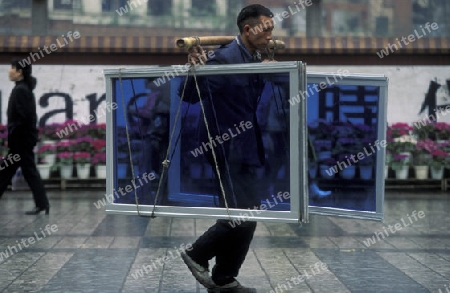 Transport people at the main square in the city of Chongqing in the province of Sichuan in china in east asia. 