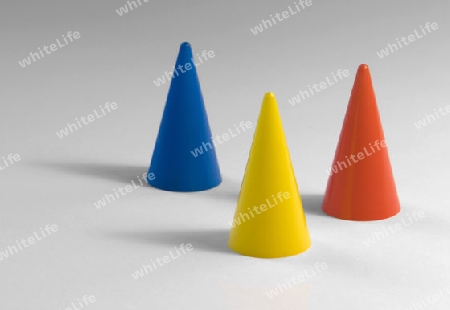 studio photography of three colored tapers in light back