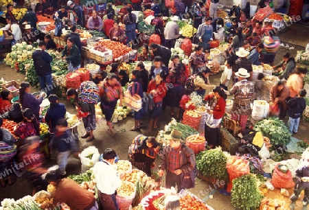 people in traditional clotes at the Market in the Village of  Chichi or Chichicastenango in Guatemala in central America.   