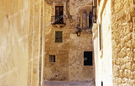 A smal road in the centre of the Old Town of the city of Valletta on the Island of Malta in the Mediterranean Sea in Europe.
