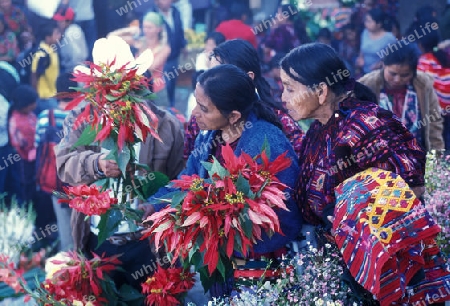 people in traditional clotes at the Market in the Village of  Chichi or Chichicastenango in Guatemala in central America.   