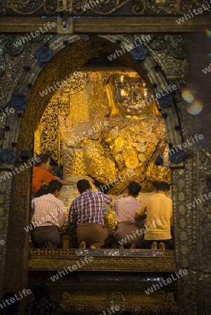 The Mahamuni Buddha at the Mahamuni temple in the City of Mandalay in Myanmar in Southeastasia.