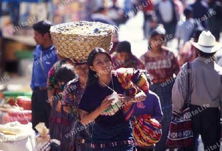 people in traditional clotes at the Market in the Village of  Chichi or Chichicastenango in Guatemala in central America.   