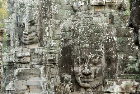 Stone Faces the Tempel Ruin of Angkor Thom in the Temple City of Angkor near the City of Siem Riep in the west of Cambodia.