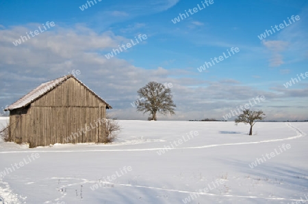 winterliche Szene mit Heuschober