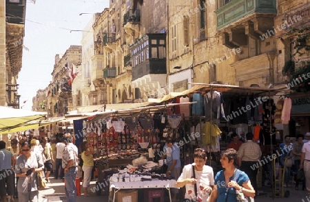 A smal road in the centre of the Old Town of the city of Valletta on the Island of Malta in the Mediterranean Sea in Europe.
