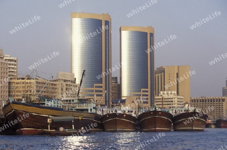 Import and export goods at the harbour at the Dubai creek in the old town in the city of Dubai in the Arab Emirates in the Gulf of Arabia.