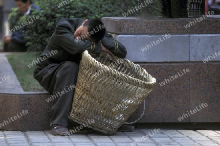 Transport people at the main square in the city of Chongqing in the province of Sichuan in china in east asia. 