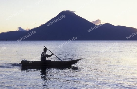 The Lake Atitlan mit the Volcanos of Toliman and San Pedro in the back at the Town of Panajachel in Guatemala in central America.   