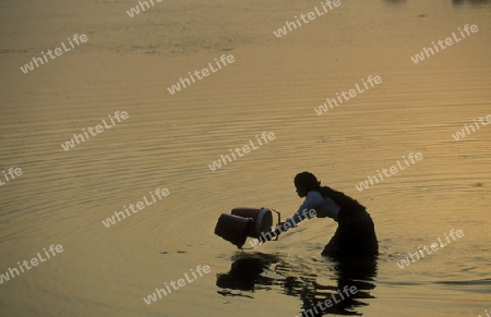 a women take water from the lake at the Prei Prasat temple in Angkor at the town of siem riep in cambodia in southeastasia. 