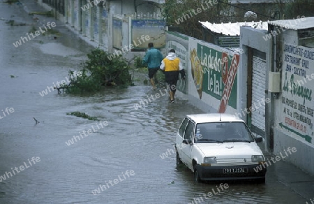  a tropical storm in the town of  St Gilles les Bains  on the Island of La Reunion in the Indian Ocean in Africa.